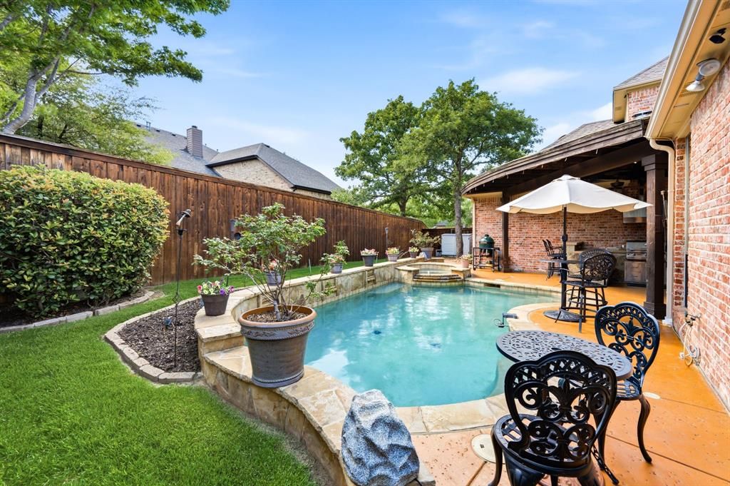 Pool with outdoor kitchen and grill